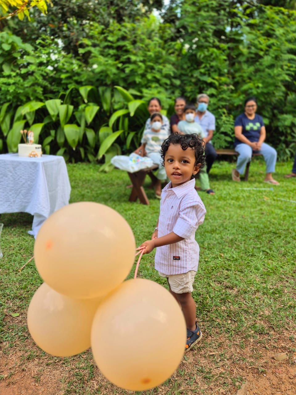 Family and neighbors gathered in the garden for the birthday